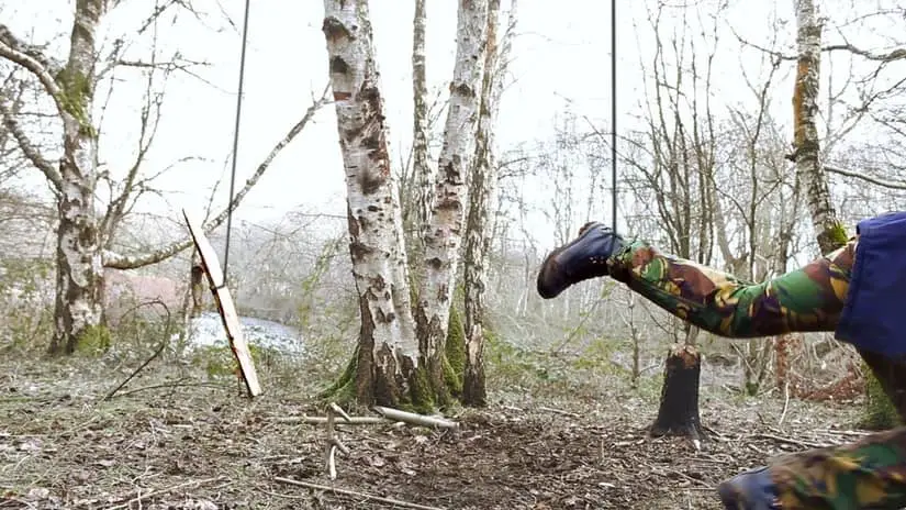 Man getting caught in a homemade noose trap