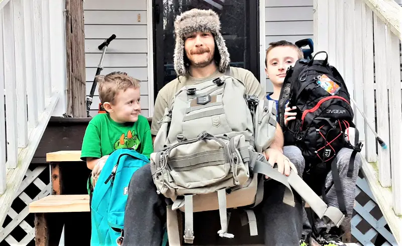 dad and sons with bug out bags