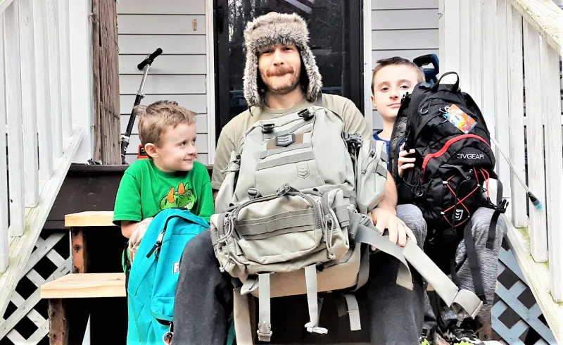 Family Bug Out Bag Guide 1 dad and sons with bug out bags