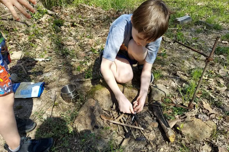 boys starting a fire