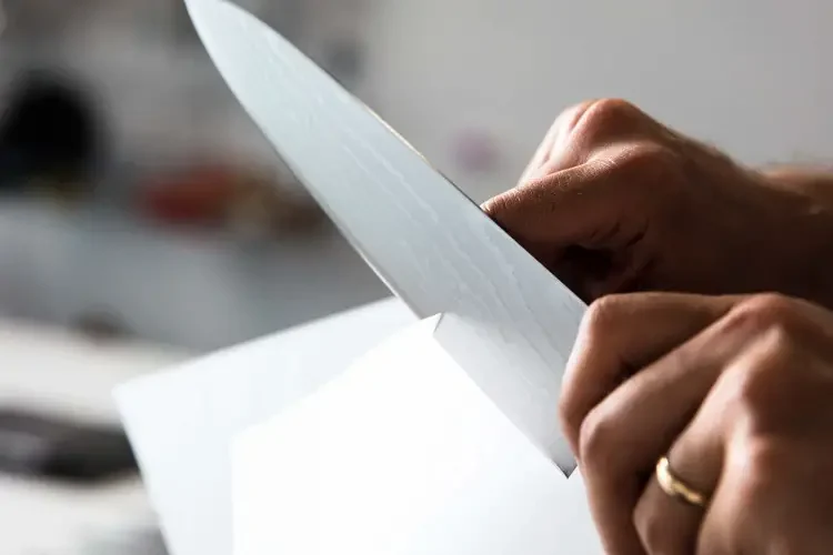 Cutting paper with sharp knife