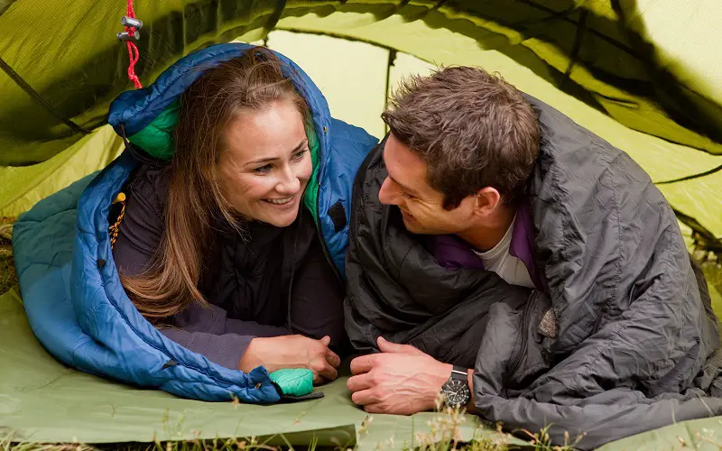 spouses spend time together while camping